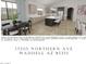 Contemporary kitchen with a large island, pendant lighting, and an open design to the living spaces at 17205 W Northern Ave, Waddell, AZ 85355