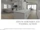 Bright and airy living space featuring an open concept kitchen with a large kitchen island at 17205 W Northern Ave, Waddell, AZ 85355