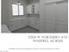 Bright laundry room features stylish cabinets, marble countertops, and patterned tile flooring at 17205 W Northern Ave, Waddell, AZ 85355