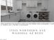 Modern laundry room featuring white cabinets, counter space, sink, and front-loading washer and dryer at 17205 W Northern Ave, Waddell, AZ 85355