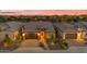 Aerial view of a single-story home with a two-car garage and desert landscaping at 175 E Santa Lucia Ln, Queen Creek, AZ 85140