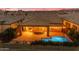 Aerial shot of a private backyard with a sparkling pool and covered patio at 175 E Santa Lucia Ln, Queen Creek, AZ 85140