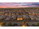 An aerial view showcases a neighborhood with private pools and well-maintained landscaping near a community at 175 E Santa Lucia Ln, Queen Creek, AZ 85140