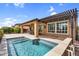 Outdoor living space with pool, covered patio, string lights and lush landscaping at 175 E Santa Lucia Ln, Queen Creek, AZ 85140
