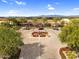 The community entrance showcases impeccable landscaping, manicured gardens, and a welcoming fountain area at 175 E Santa Lucia Ln, Queen Creek, AZ 85140
