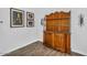Dining room hutch with wooden display and wood-look tile flooring at 175 E Santa Lucia Ln, Queen Creek, AZ 85140
