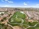 Aerial showcases the golf course flowing through the upscale neighborhood, providing scenic views and a sense of community at 175 E Santa Lucia Ln, Queen Creek, AZ 85140