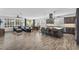 Open floor plan with tile floors, a kitchen island with seating, and a living room with a blue sofa at 175 E Santa Lucia Ln, Queen Creek, AZ 85140