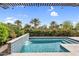 Stunning pool area with waterfall feature, desert landscaping and covered patio at 175 E Santa Lucia Ln, Queen Creek, AZ 85140