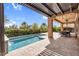 Beautiful backyard oasis with pool, covered patio, and lush landscaping at 175 E Santa Lucia Ln, Queen Creek, AZ 85140