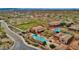 Aerial view of community pools and neighborhood amenities, including walking paths and green spaces at 18438 N 96Th Way, Scottsdale, AZ 85255