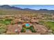 Aerial view of the community showcasing multiple pools, lush landscaping, and beautiful architecture at 18438 N 96Th Way, Scottsdale, AZ 85255