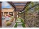 Landscaped backyard with stone pathway, artificial turf, and an outdoor seating area at 18438 N 96Th Way, Scottsdale, AZ 85255