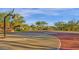 Community basketball court with well-maintained surface and hoops for sports and recreation at 18438 N 96Th Way, Scottsdale, AZ 85255