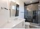 Modern bathroom featuring a glass shower and a sleek vanity with a white countertop at 18438 N 96Th Way, Scottsdale, AZ 85255