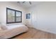 Bright bedroom with natural light from window and wood floors at 18438 N 96Th Way, Scottsdale, AZ 85255