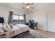 Neutral bedroom featuring a cozy bed, desk, and a relaxing space with outdoor views at 18438 N 96Th Way, Scottsdale, AZ 85255