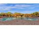 Resort-style community pool area with cabanas, lounge chairs, and picturesque mountain views at 18438 N 96Th Way, Scottsdale, AZ 85255
