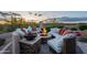 Cozy outdoor fire pit with comfortable seating, perfect for gatherings and evening relaxation at 18438 N 96Th Way, Scottsdale, AZ 85255