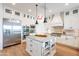 Well-equipped kitchen with a center island, perfect for cooking and entertaining at 18438 N 96Th Way, Scottsdale, AZ 85255