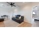 Bonus room with sofa and ottoman in a well-lit space at 18438 N 96Th Way, Scottsdale, AZ 85255