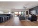 Relaxing living room with stylish decor, a sliding glass door to the outdoor patio, and a breakfast bar area at 18438 N 96Th Way, Scottsdale, AZ 85255