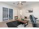 Bright living room features wood floors, plantation shutters, and comfortable seating at 18438 N 96Th Way, Scottsdale, AZ 85255