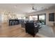 Bright and airy living room featuring an open floor plan, modern decor, and access to the outdoor space at 18438 N 96Th Way, Scottsdale, AZ 85255