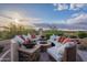 Charming patio with comfortable seating, a cozy fire pit, and scenic views at 18438 N 96Th Way, Scottsdale, AZ 85255