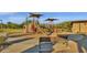 Playground with climbing wall, slide, and shade covers offering fun and safe play for  at 18438 N 96Th Way, Scottsdale, AZ 85255