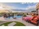 Backyard pool and spa with lush landscaping and comfortable lounge chairs at 18438 N 96Th Way, Scottsdale, AZ 85255