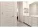 Bathroom with white vanity, subway tile shower visible through the doorway, and view into bedroom at 1851 E Frye Rd # 101, Gilbert, AZ 85295