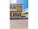 Two-story home featuring dual garage doors and a cozy second-story balcony at 1851 E Frye Rd # 101, Gilbert, AZ 85295