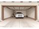 Attached garage with a car parked inside and extra storage space along the walls at 1851 E Frye Rd # 101, Gilbert, AZ 85295