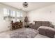 Living room featuring a cozy sectional sofa, media center, and bright natural light at 1851 E Frye Rd # 101, Gilbert, AZ 85295