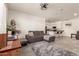 Open concept living room featuring a kitchen island and comfortable sectional seating at 1851 E Frye Rd # 101, Gilbert, AZ 85295