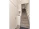 A carpeted stairwell with white walls leads to the upper level of the home at 1851 E Frye Rd # 101, Gilbert, AZ 85295