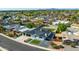 An aerial view shows the roof, lawns, and driveway of this beautiful home nestled in the neighborhood at 1868 E La Donna Dr, Tempe, AZ 85283