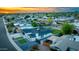 Panoramic aerial view showcasing a modern home with manicured landscaping, a spacious driveway, and neighborhood views at 1868 E La Donna Dr, Tempe, AZ 85283