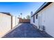 Long private driveway leads to gated yard at 1868 E La Donna Dr, Tempe, AZ 85283