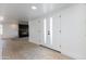 Bright foyer featuring ceramic tile floors and a fireplace in the adjacent room at 1868 E La Donna Dr, Tempe, AZ 85283