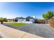 Attractive one-story house with a three-car garage, well-kept landscaping, and a paved driveway at 1868 E La Donna Dr, Tempe, AZ 85283