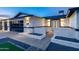 Close-up of the home's front exterior with stylish lighting, a modern garage door, and a well-maintained landscape at 1868 E La Donna Dr, Tempe, AZ 85283
