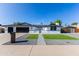 Stunning one-story home featuring a three-car garage and beautifully landscaped front yard at 1868 E La Donna Dr, Tempe, AZ 85283