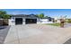 Charming single-story home with a three-car garage, manicured lawn, and modern curb appeal at 1868 E La Donna Dr, Tempe, AZ 85283