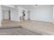 Spacious living room featuring ceramic tile floors, open layout, and an adjoining room at 1868 E La Donna Dr, Tempe, AZ 85283