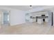 Bright, open layout showcasing the living room's connection to the modern kitchen and dining areas at 1868 E La Donna Dr, Tempe, AZ 85283