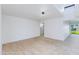 Open living area with tile floors, recessed lighting, and ample natural light from large windows at 1868 E La Donna Dr, Tempe, AZ 85283