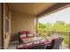 Relaxing balcony with comfortable outdoor seating and a view of the surrounding landscape at 1945 W Desert Vista Trl # 77, Phoenix, AZ 85085