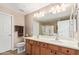 Well-lit bathroom with double sinks, ample counter space, and a large mirror for convenience at 1945 W Desert Vista Trl # 77, Phoenix, AZ 85085